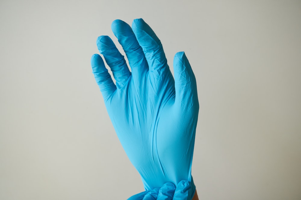 persons hand with blue light