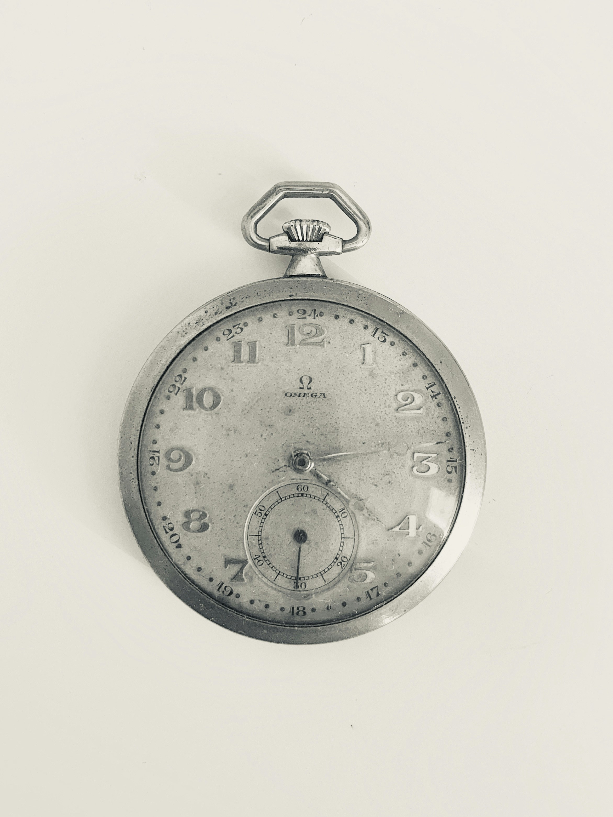 Antique pocket watch movement, vintage calibre, yellowed with age, dim historical lighting