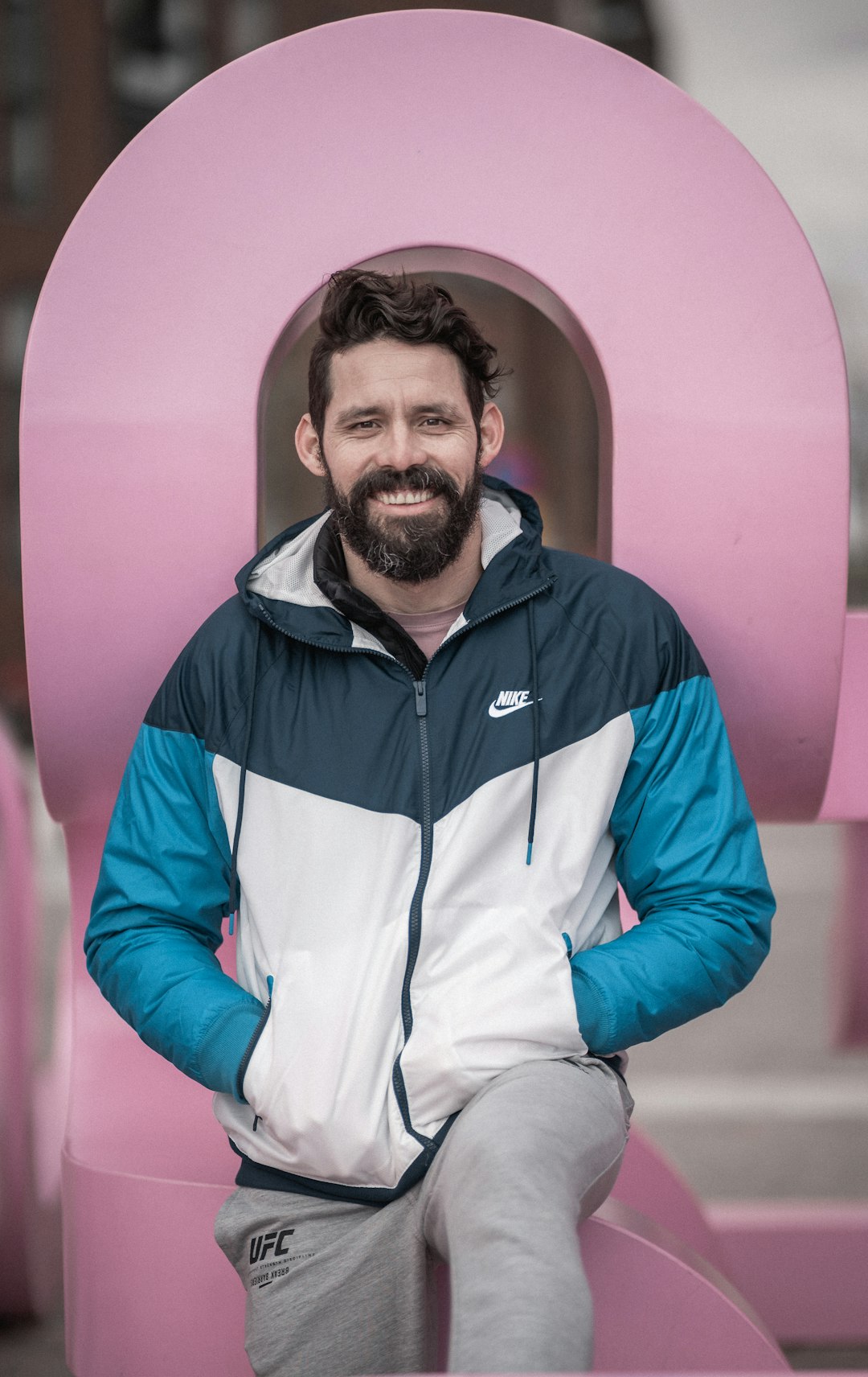 man in blue and white zip up jacket