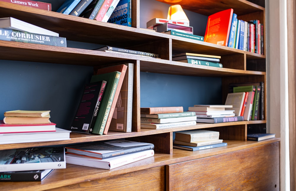 books on brown wooden shelf