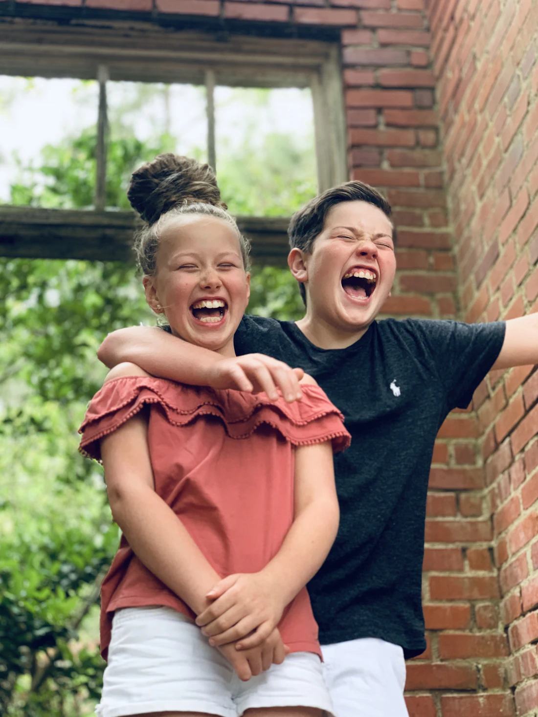 Friends and family laughing together outside