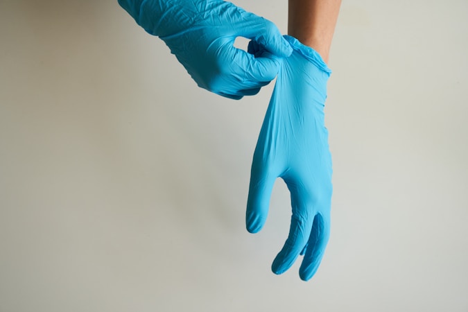 person with a pair of nitrile gloves