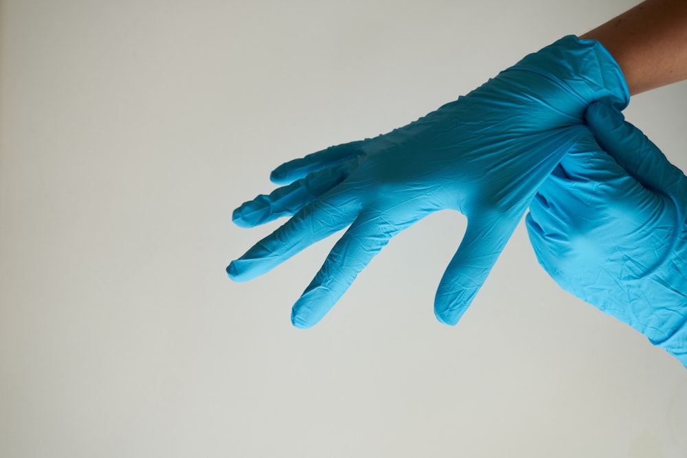 persons hand with blue paint