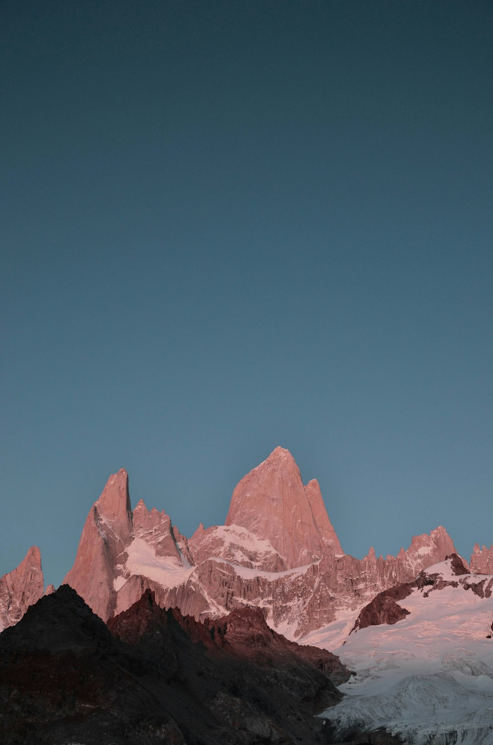 brown rocky mountain under blue sky during daytime