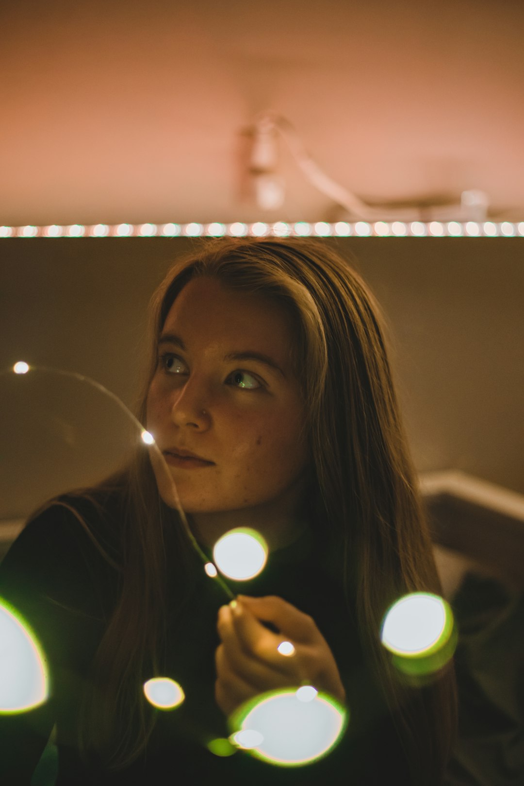 woman with green light on her face