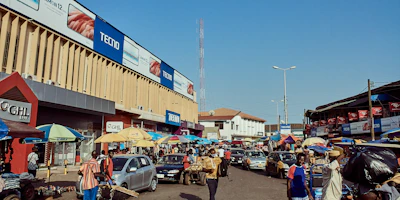 A vibrant marketplace scene showing people using their phones to chat and trade items.