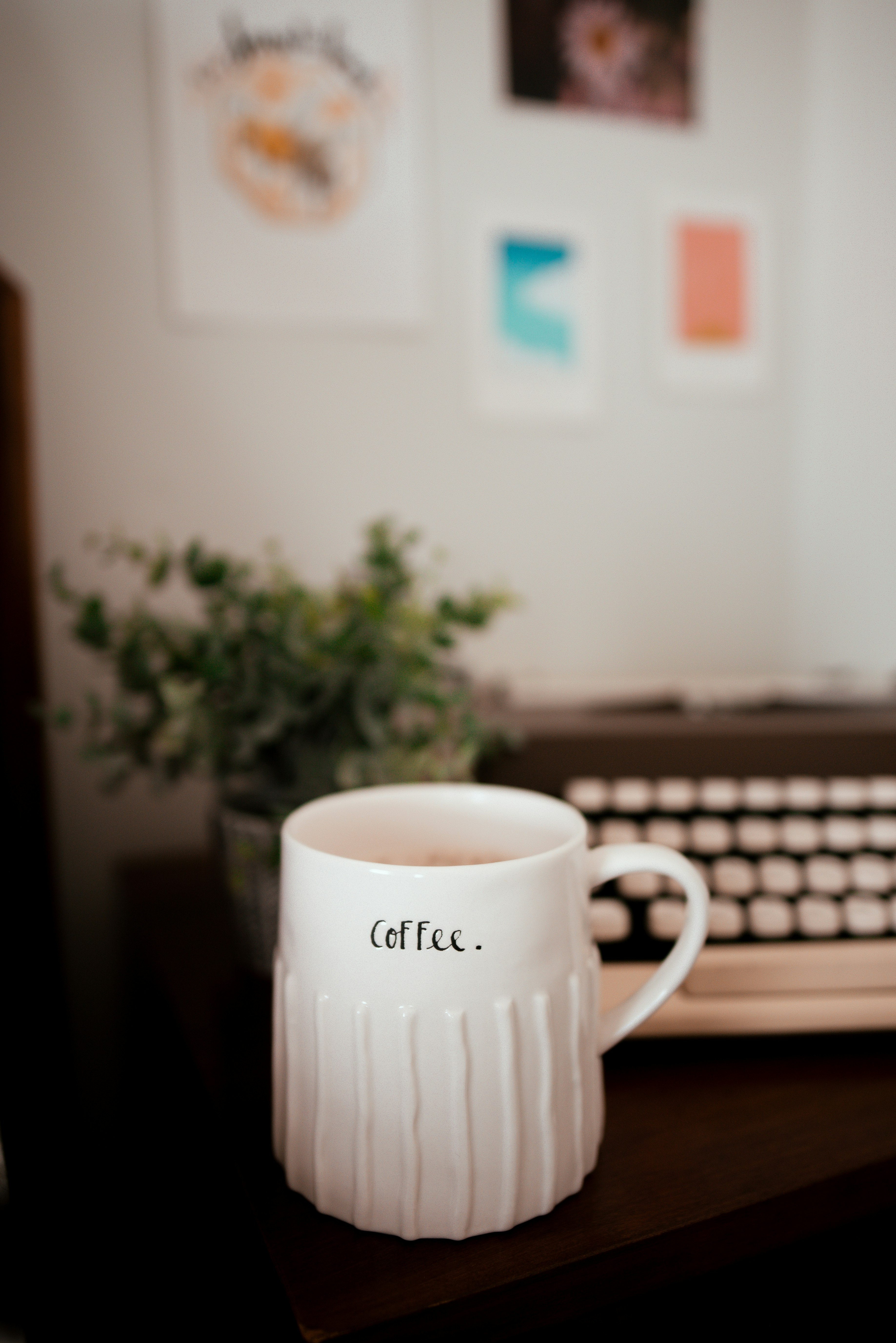 white ceramic mug on brown wooden table