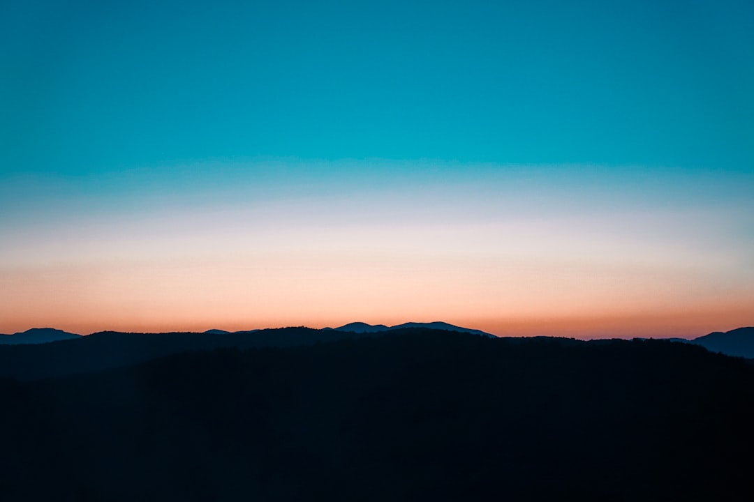 silhouette of mountain during sunset