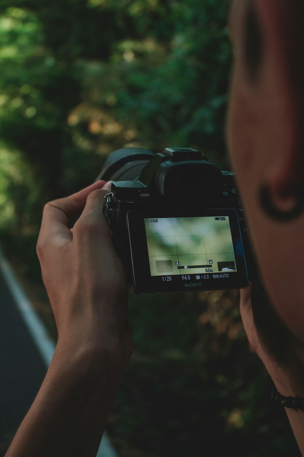 person holding black dslr camera