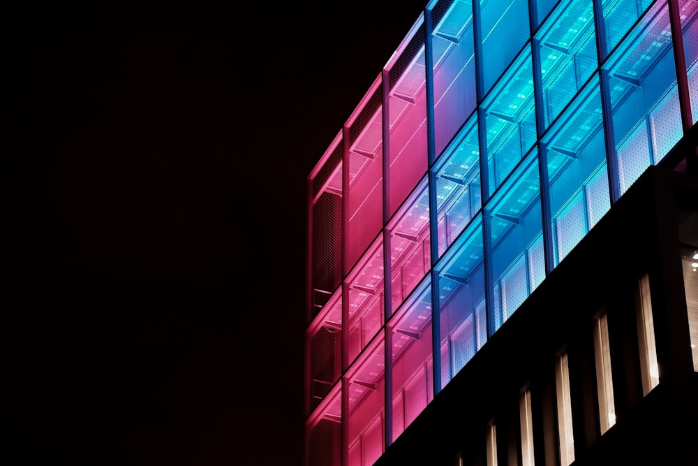 blue and pink glass walled building