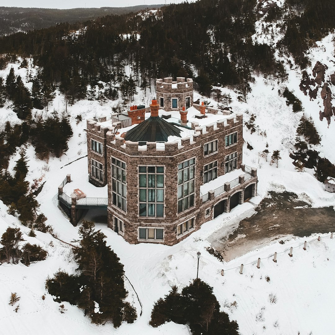 brown and white house on snow covered ground