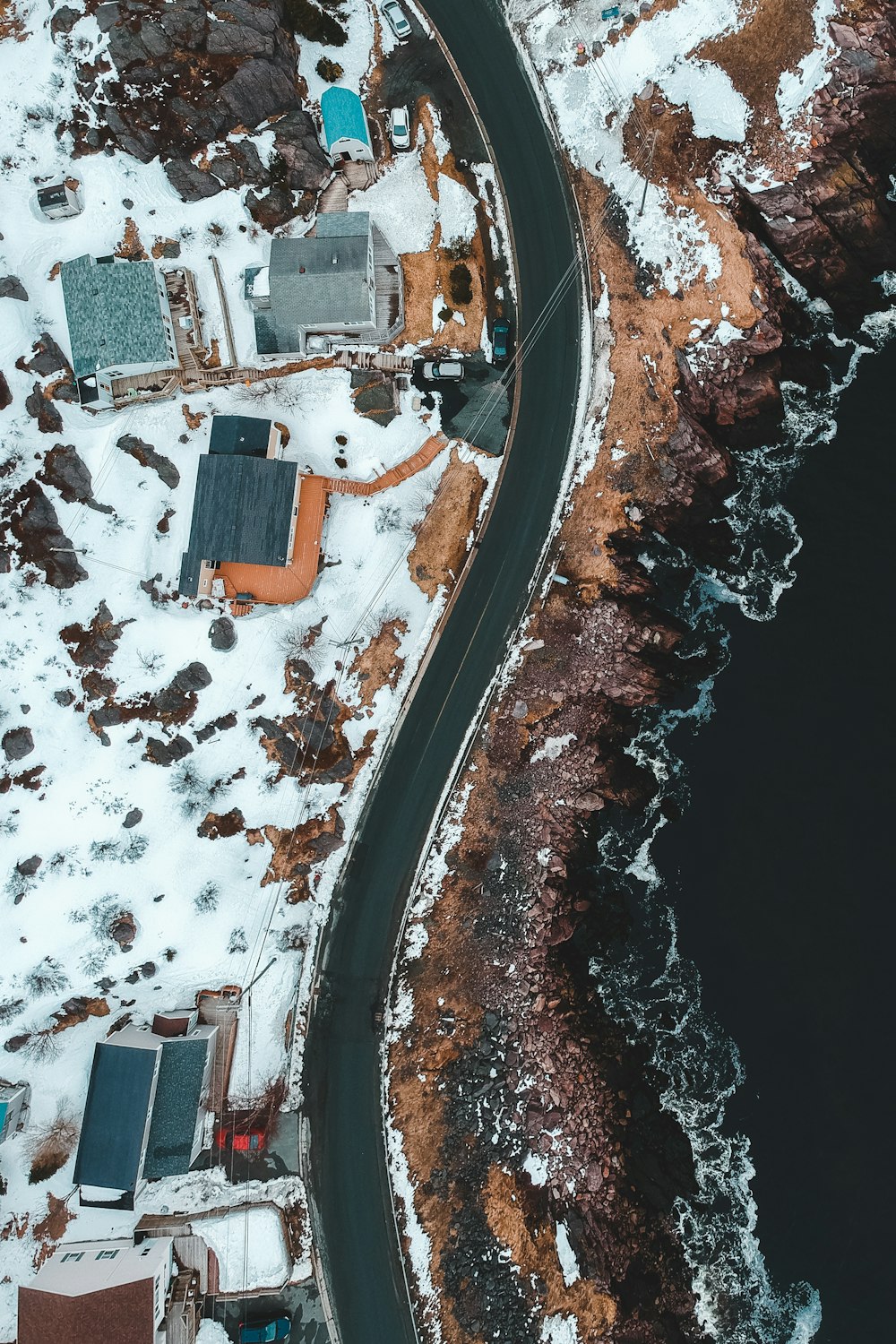 aerial view of city buildings near body of water during daytime