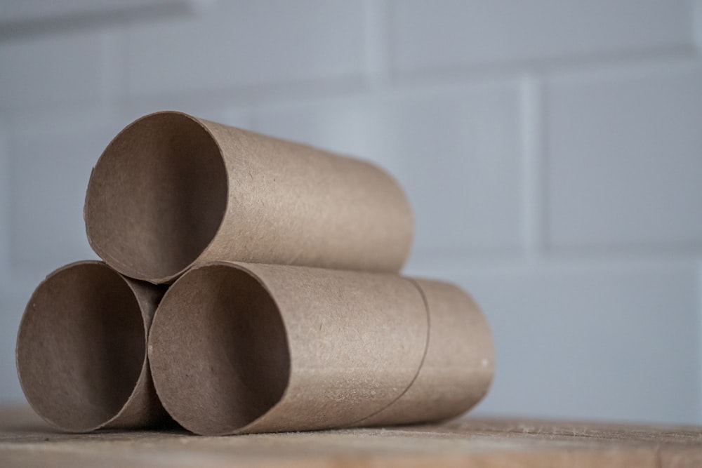 brown wooden cups on brown wooden table