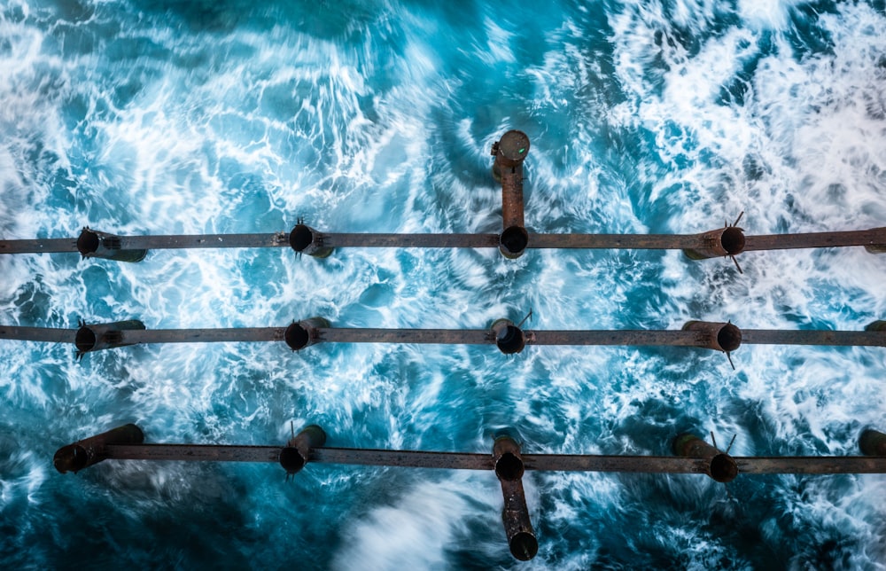 brown wooden dock on blue body of water during daytime