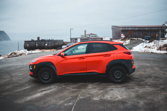 A compact SUV ready for a week-long trip, parked near a popular Orlando landmark.