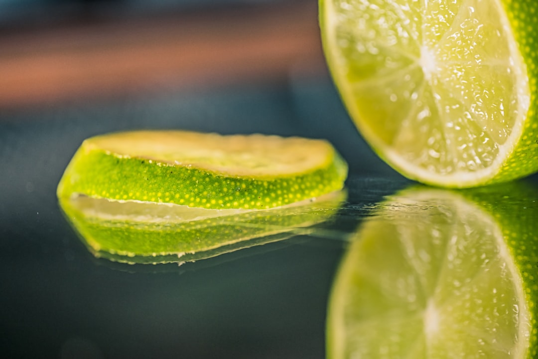 green lemon on water during daytime