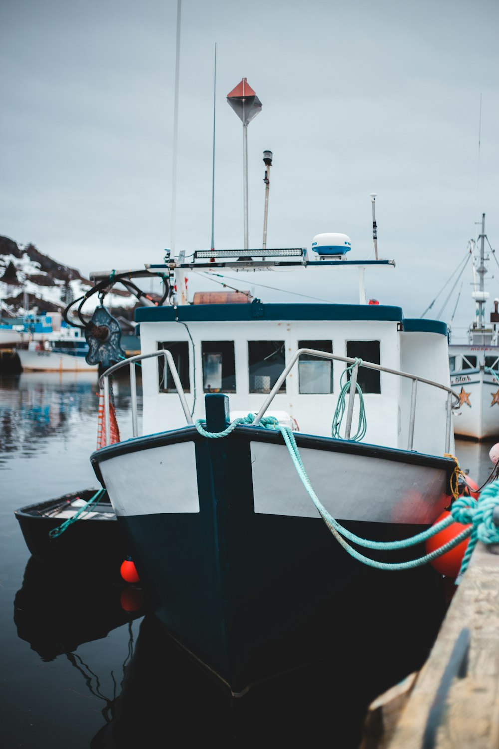 white and black boat on water during daytime