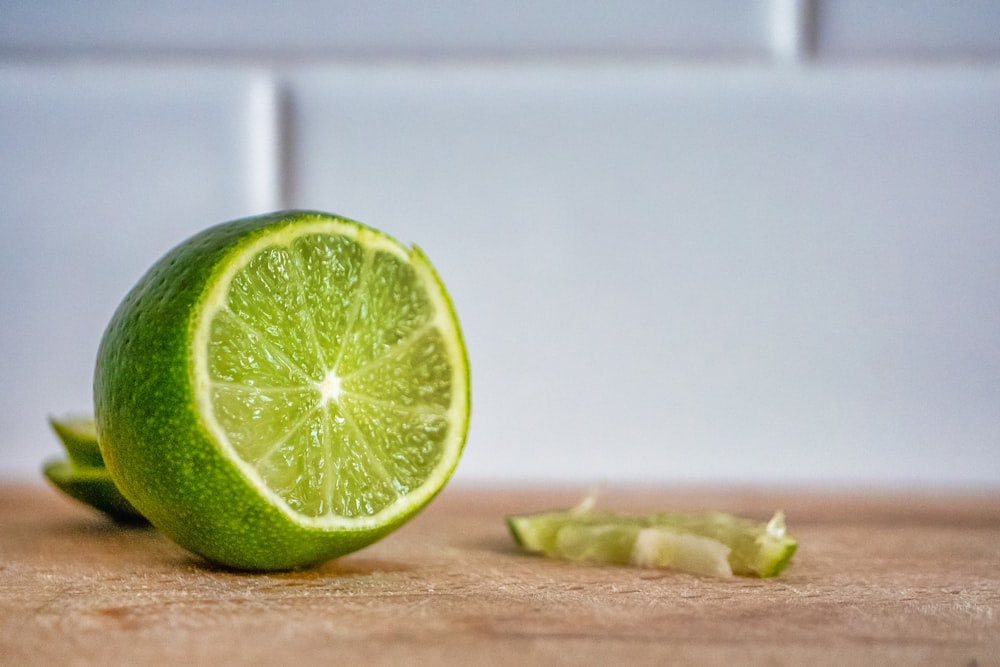 sliced lemon on brown wooden table