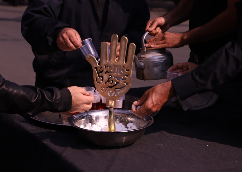 person holding stainless steel container