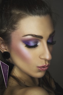 woman with pink lipstick and black mascara