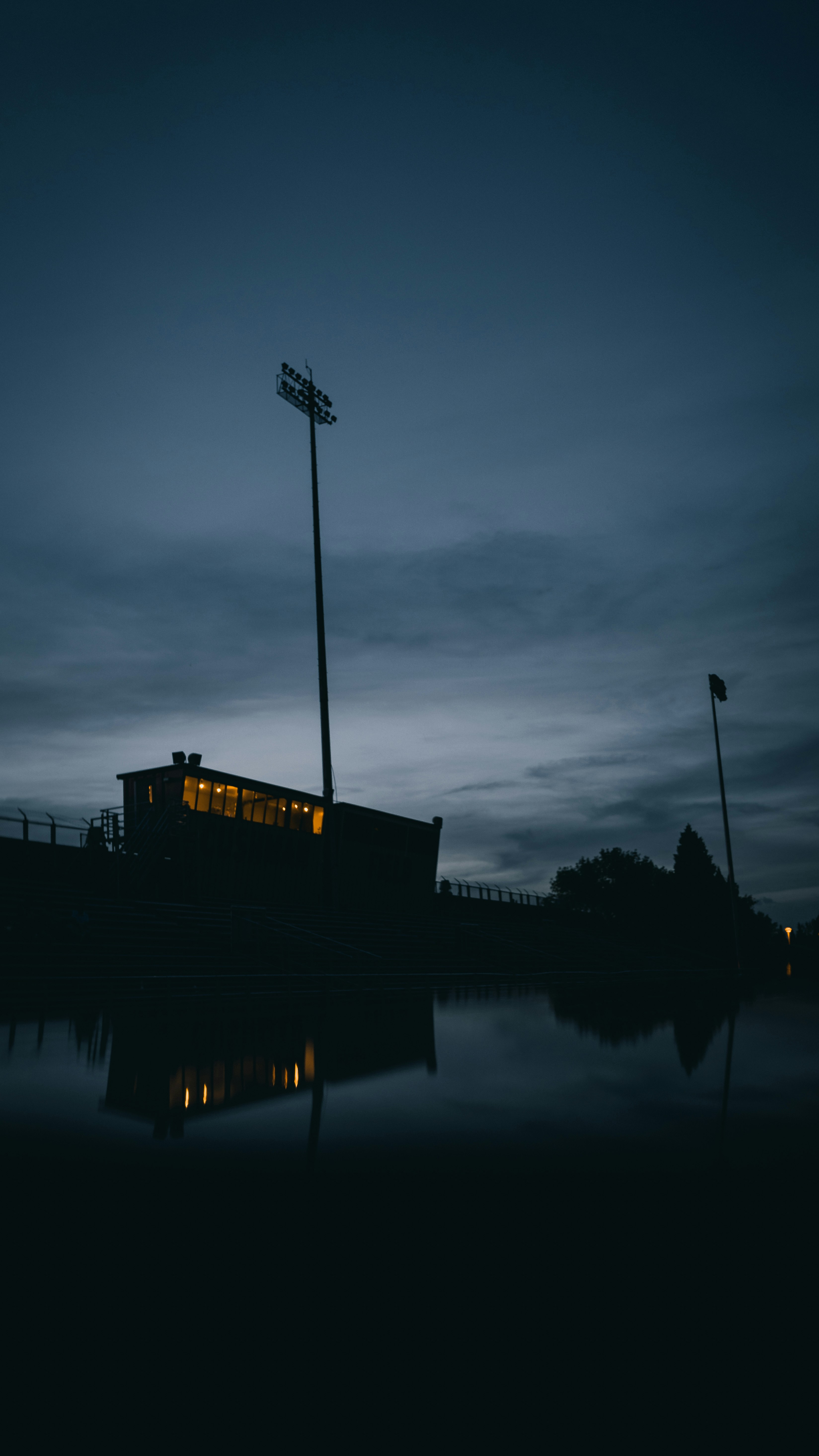black and white ship on water under gray clouds