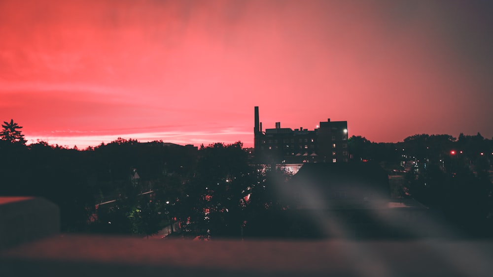 silhouette of building during night time