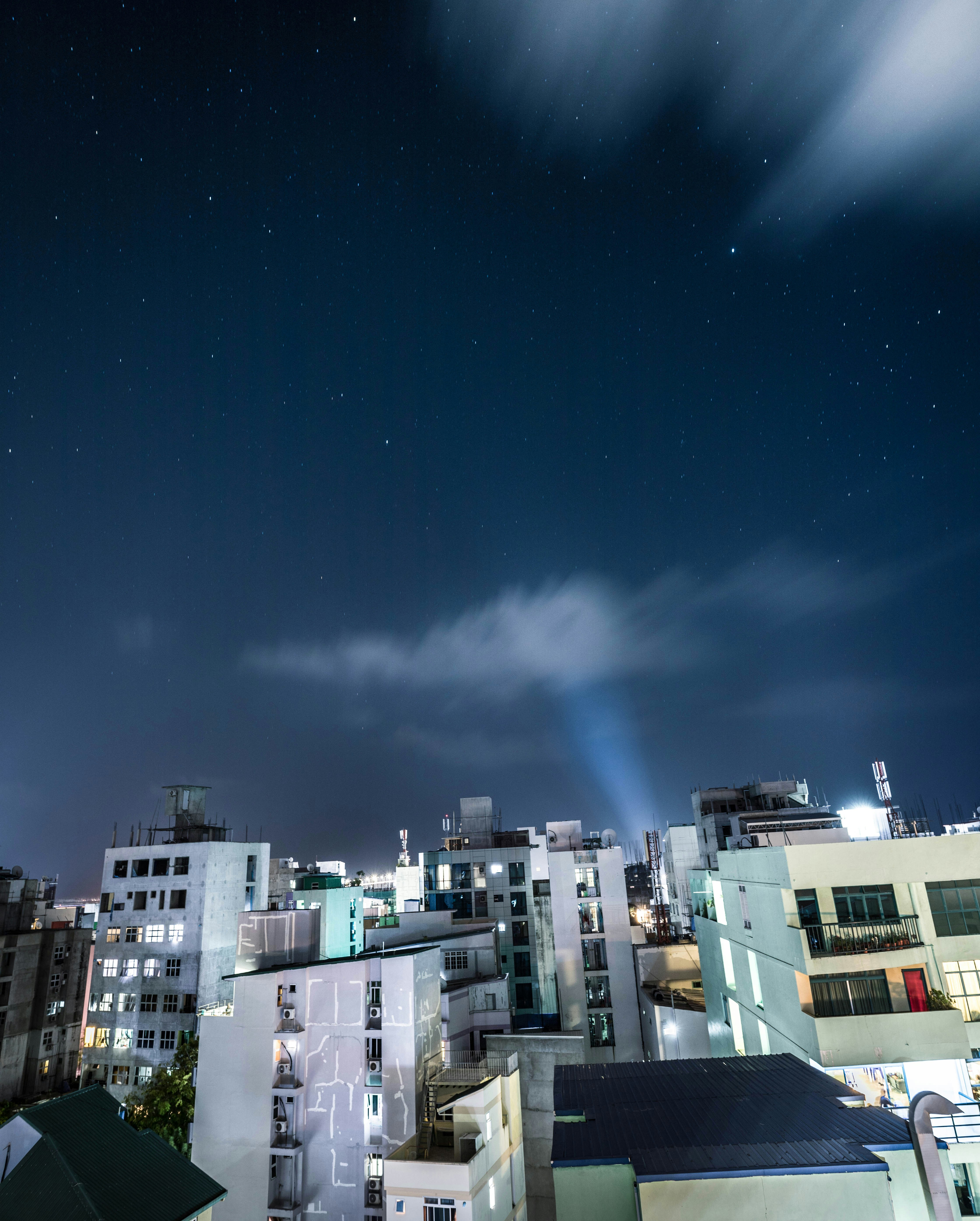 white and brown concrete buildings under blue sky during nighttime