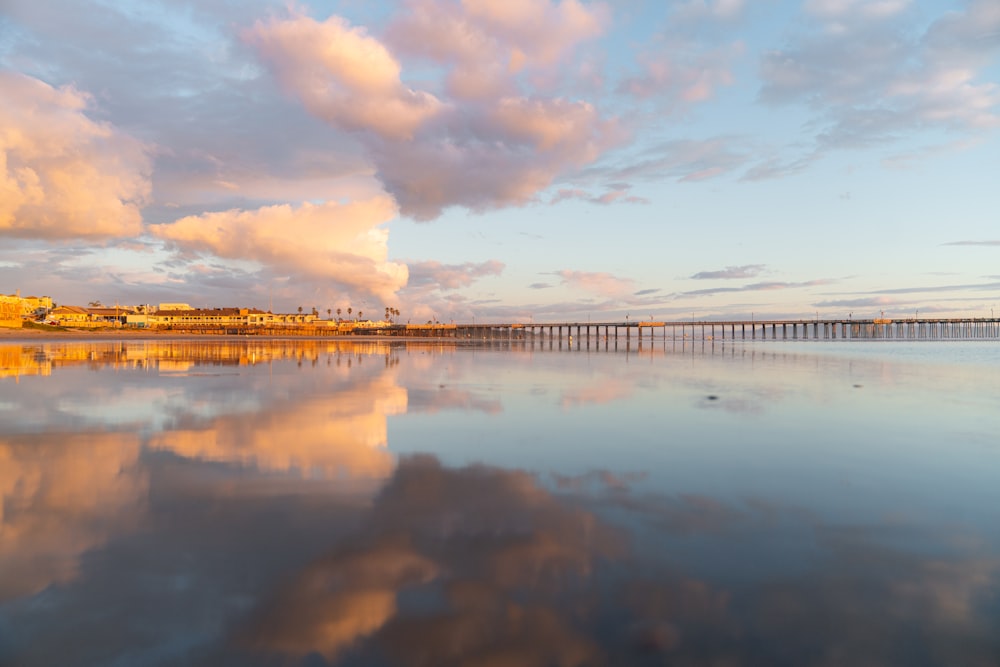 body of water under cloudy sky during daytime