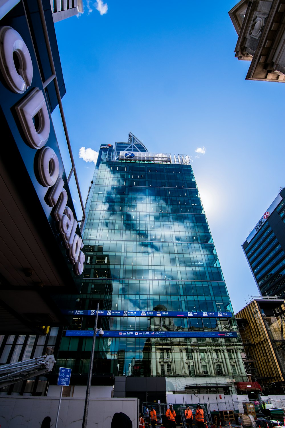 blue glass walled high rise building during night time