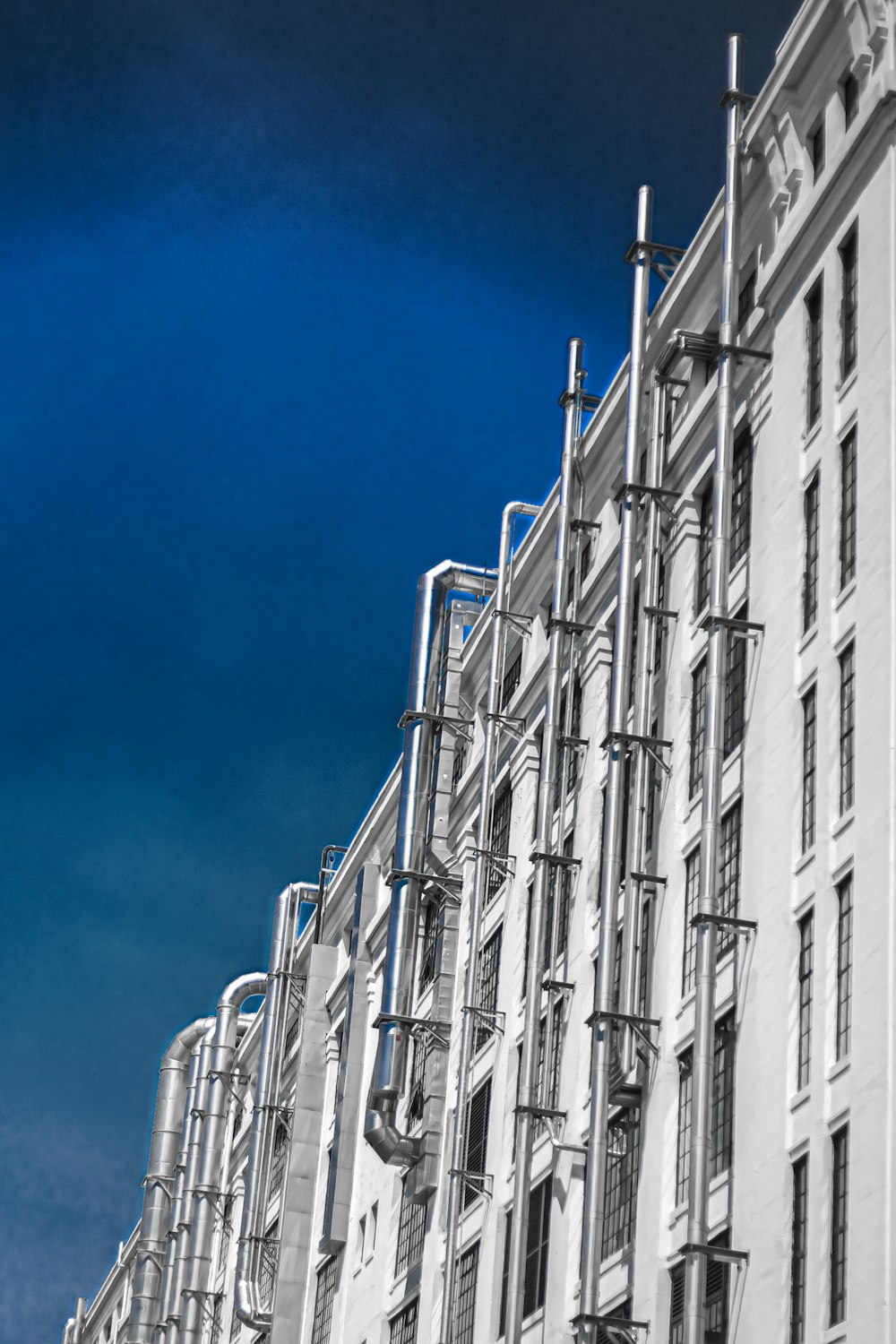 white concrete building under blue sky during daytime