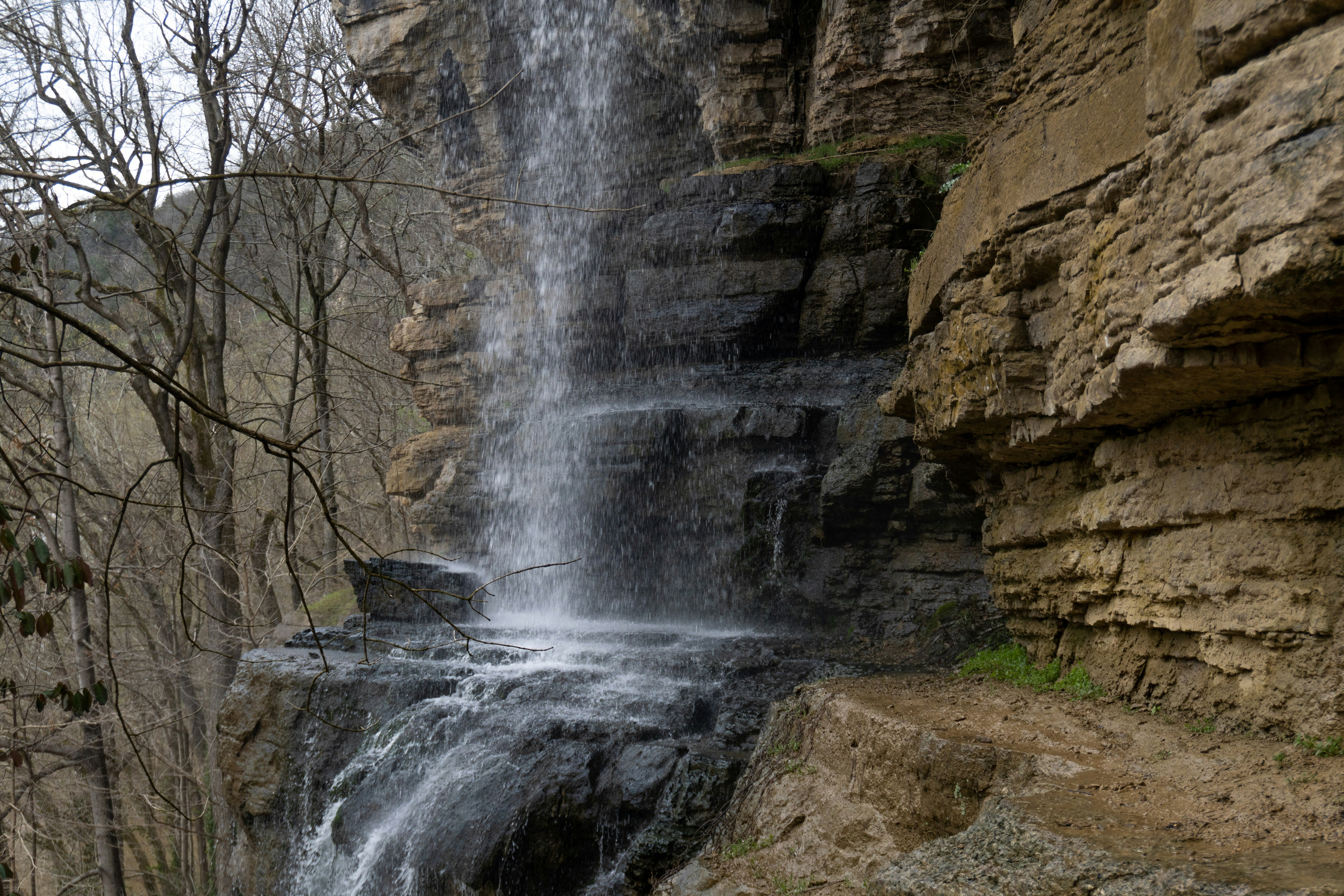 waterfalls in rocky mountain during daytime, 