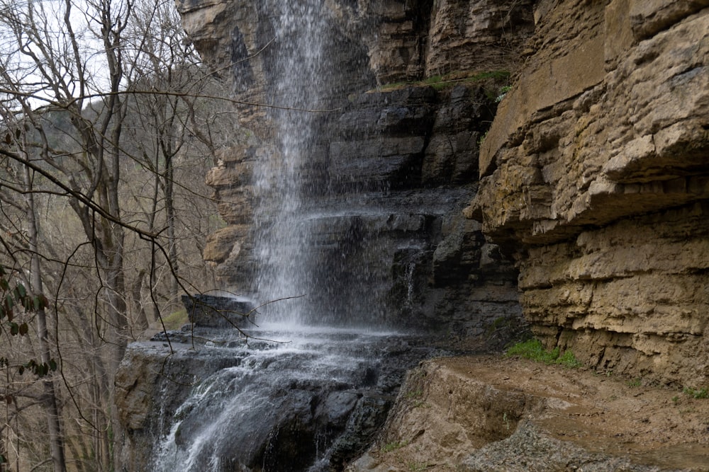 waterfalls in rocky mountain during daytime