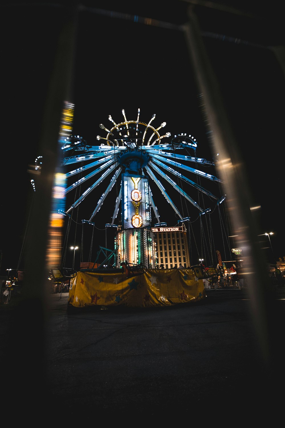 blue and yellow ferris wheel during night time