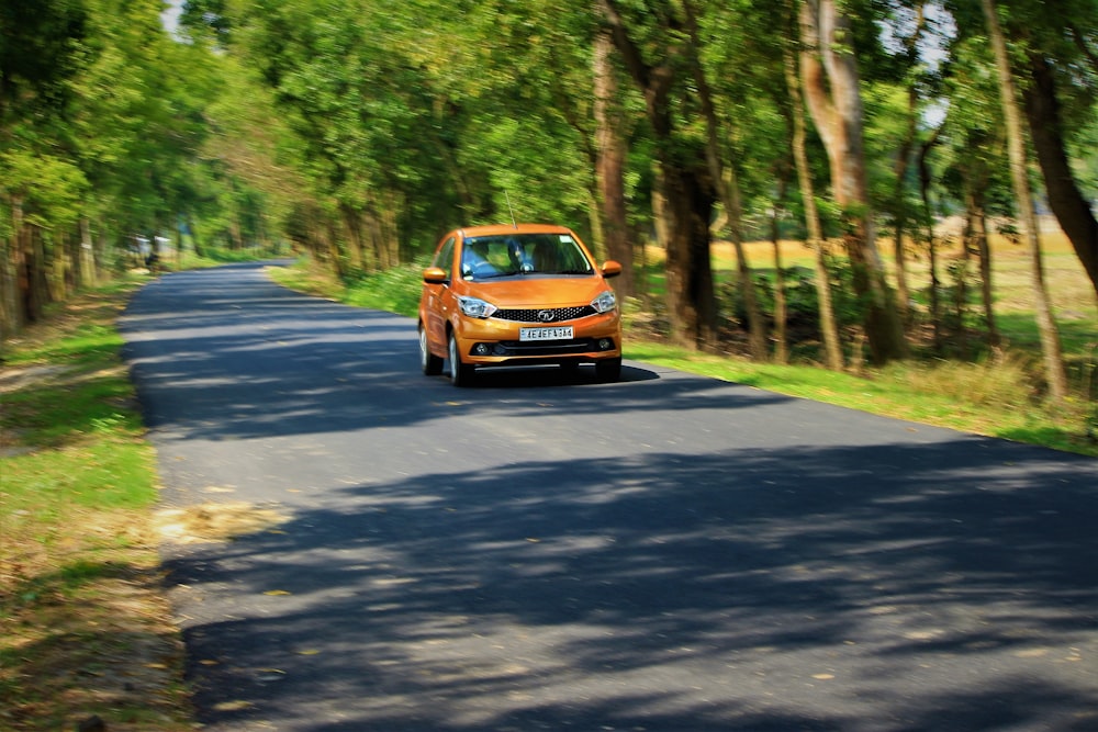 blue and orange car on road