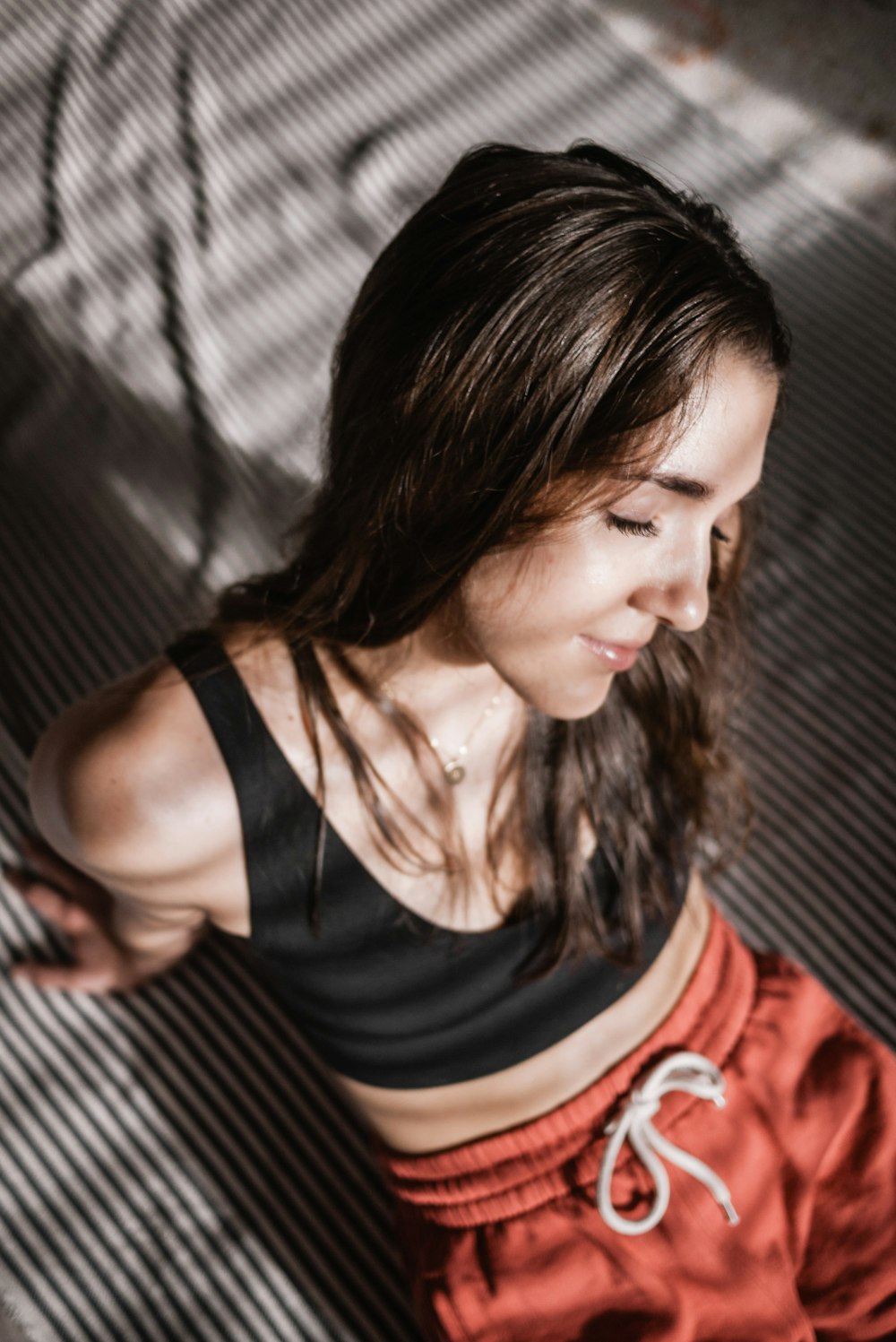 woman in black and white stripe tank top