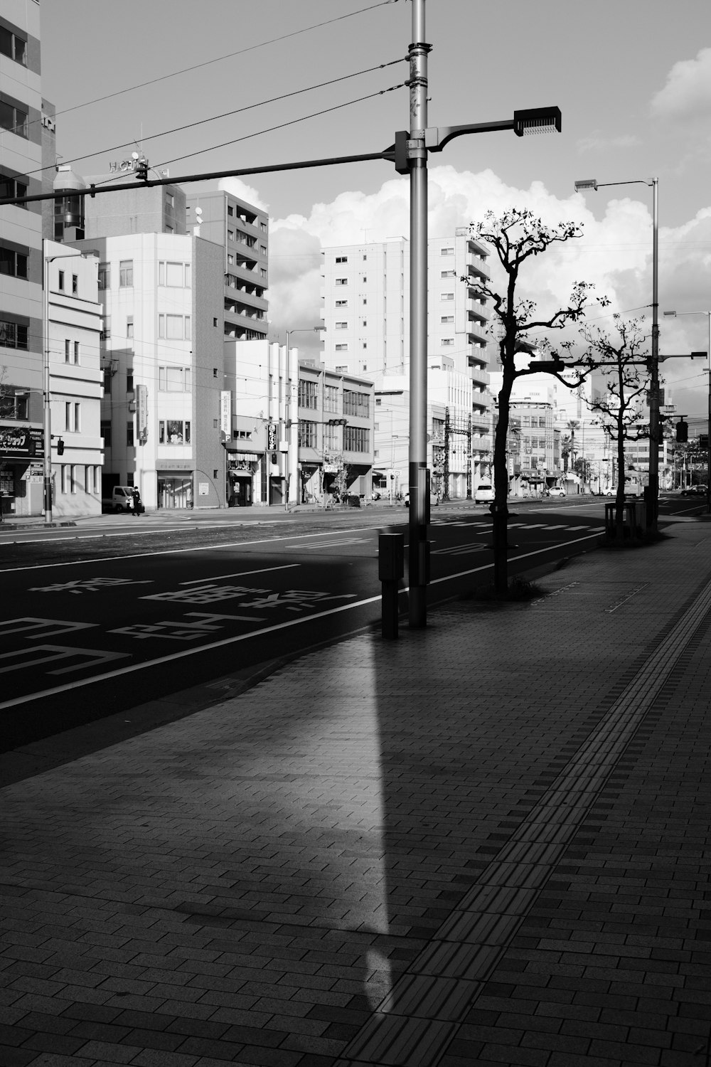 grayscale photo of city buildings