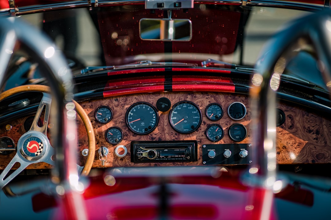 red and black car steering wheel