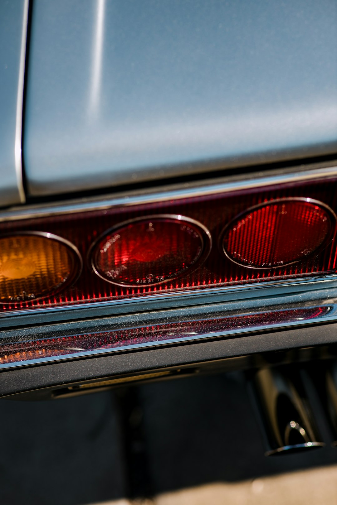 grey and red car headlight