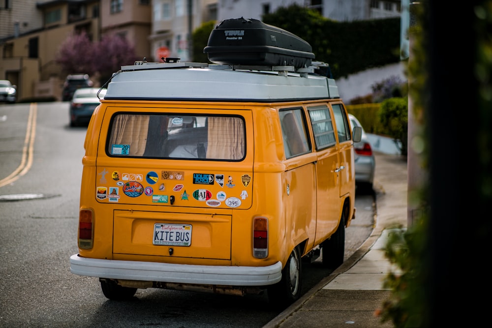 yellow and white volkswagen t-2 van on road during daytime