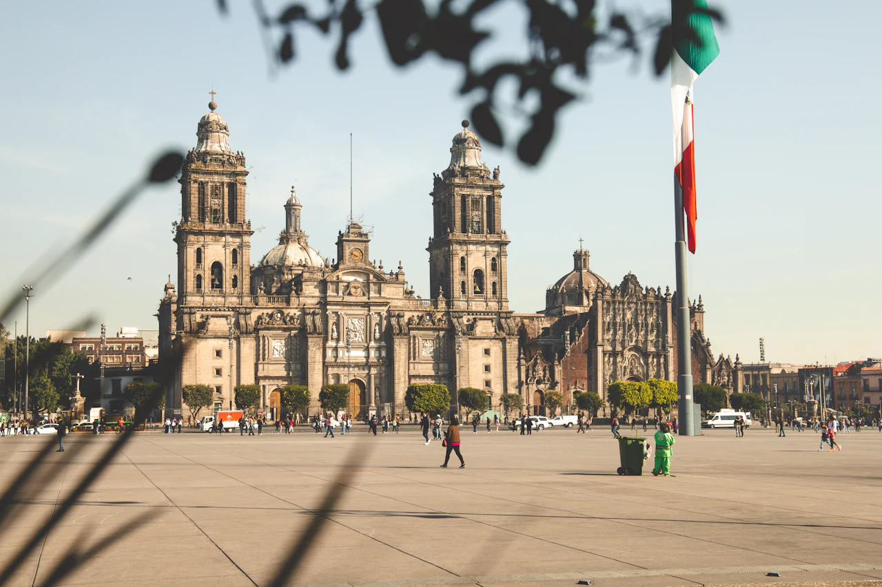 The Metropolitan Cathedral across the Zocalo, flag at half-mast in the foreground