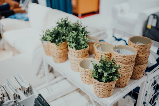 A set of woven-style plastic storage baskets filled with household items in a cozy room.