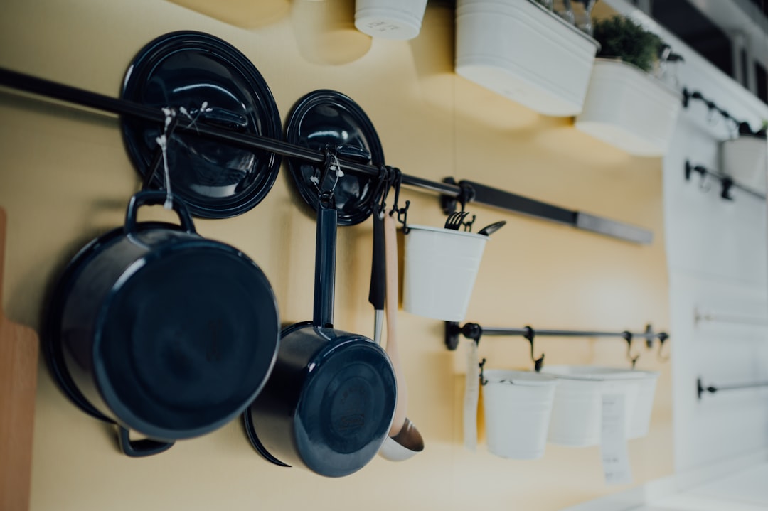 black cooking pots on stove