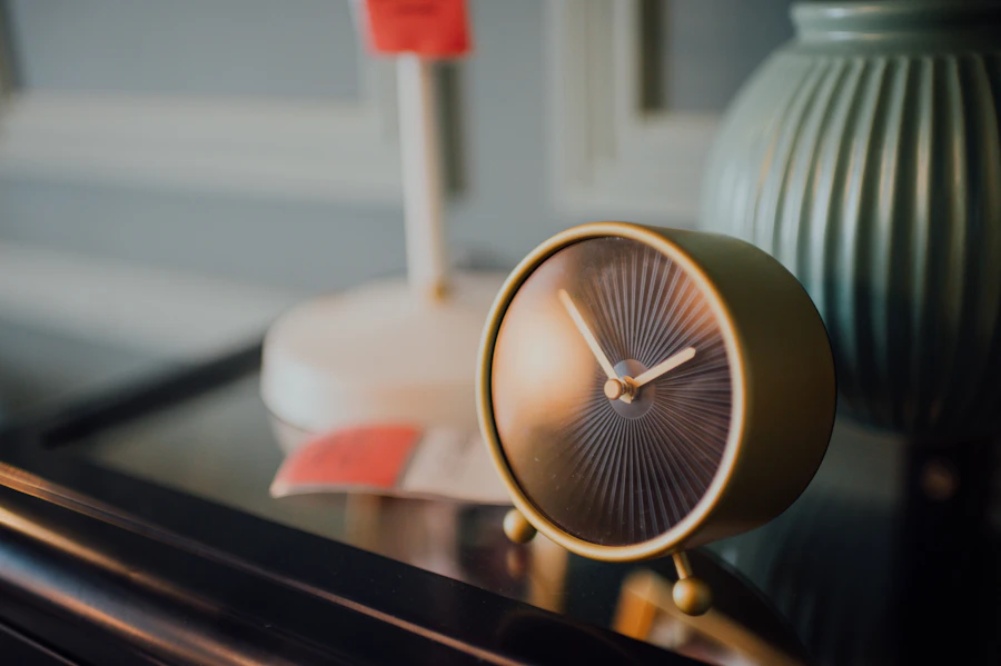 A Danish design table alarm clock on a bedside table