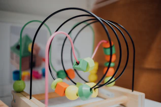 multi color plastic toy on brown wooden board