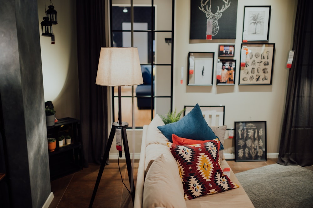 black and white floor lamp beside white couch