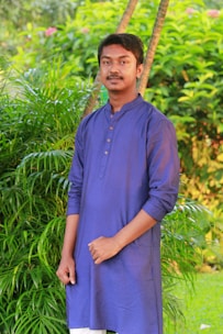 A stylish young Indian man wearing a breathable bamboo t-shirt in a casual urban setting.