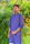 Young Indian man looking determined, standing outdoors with a sunrise in the background.
