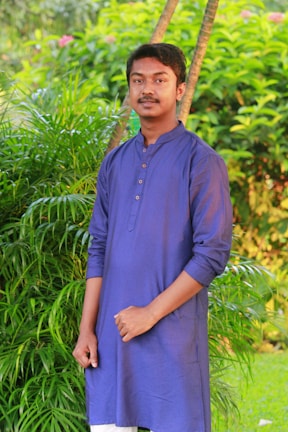 A young man in a crisp kurta set against a colorful Nagpur street backdrop.