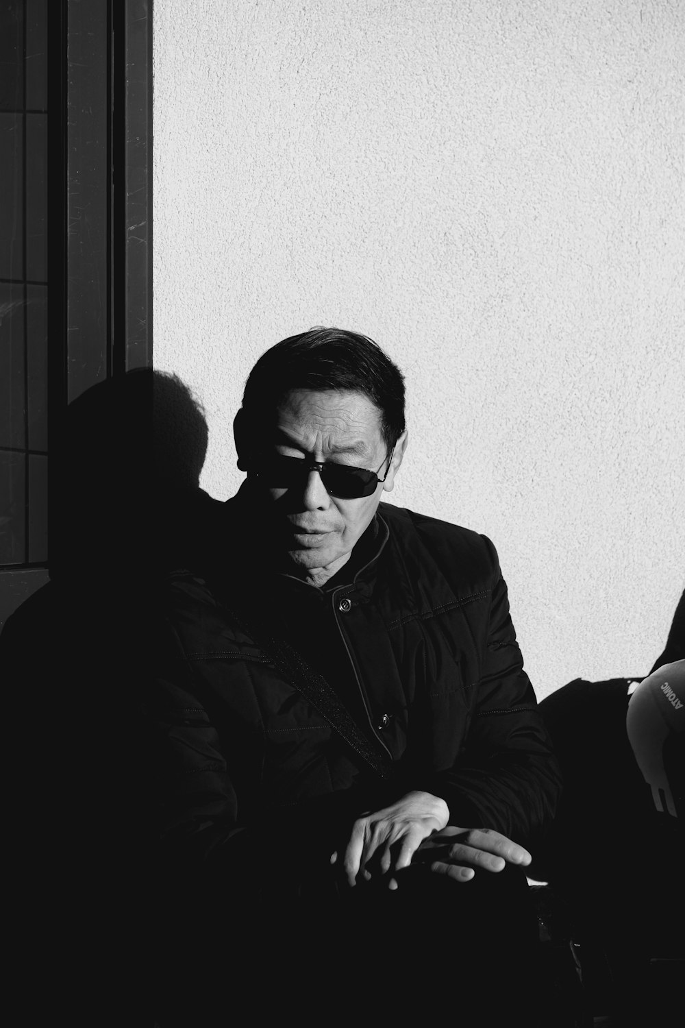 man in black jacket wearing sunglasses