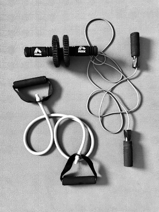 black and silver bluetooth earphones